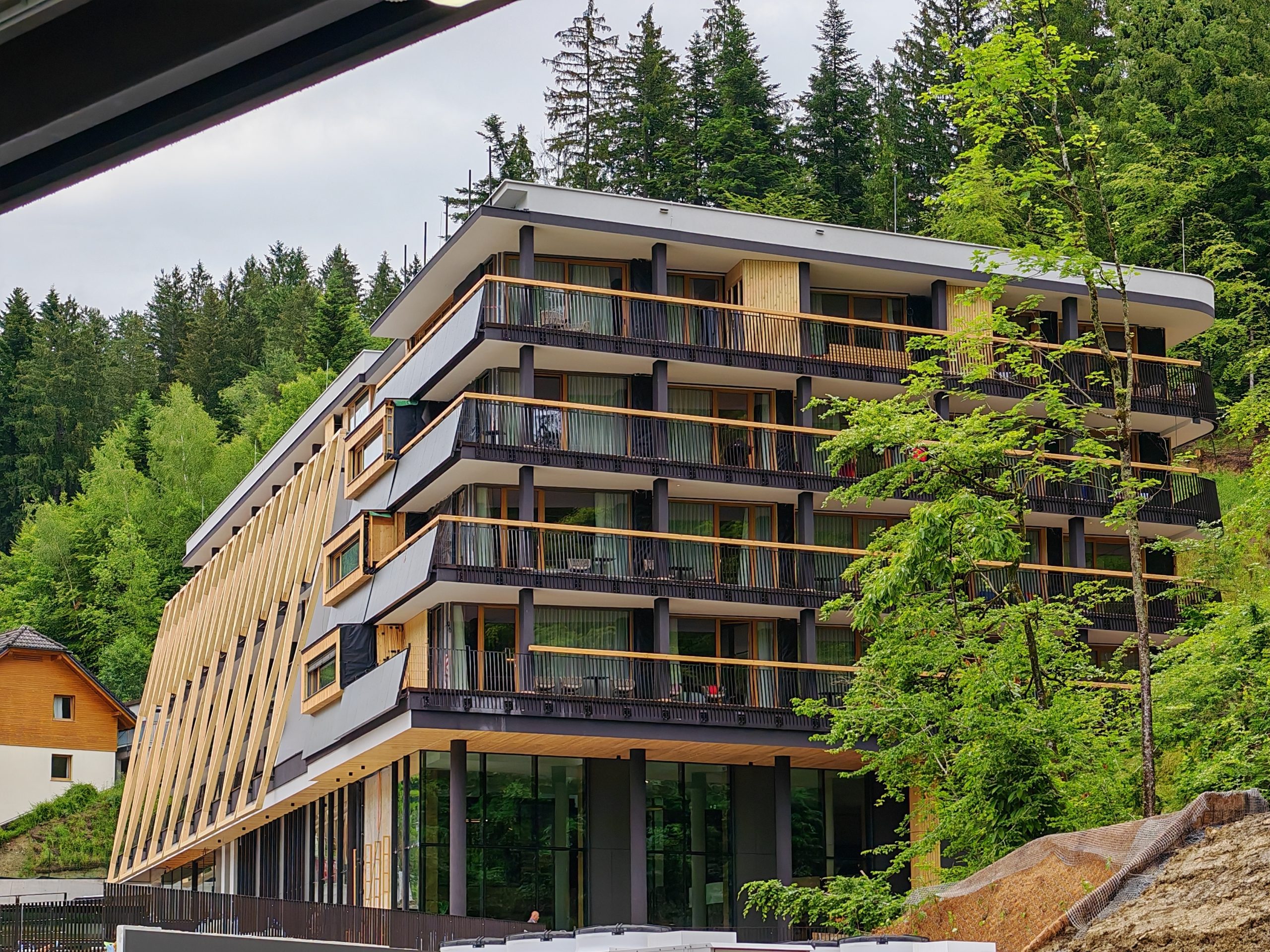 NaturHotel Snovik: Why Slovenia’s Premier Eco-Spa Holds 4* Superior and What Separates It From the 5th Star 1 Exterior view of the sustainable wooden architecture of NaturHotel Snovik in Slovenia