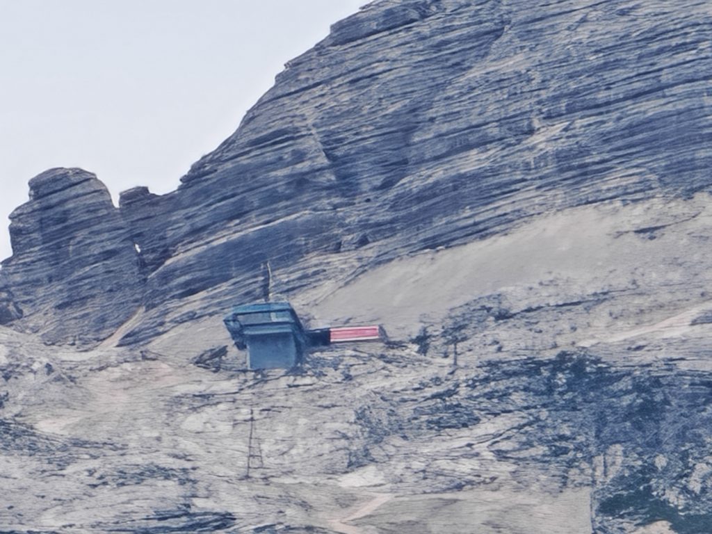 My Honest Experience in Bovec, Slovenia (2026): Where to Stay, Swim, Eat & Discover the Soča Valley 3 High-altitude Kanin cable car station built into the steep rocky cliffs of Mount Kanin near Bovec, Slovenia.